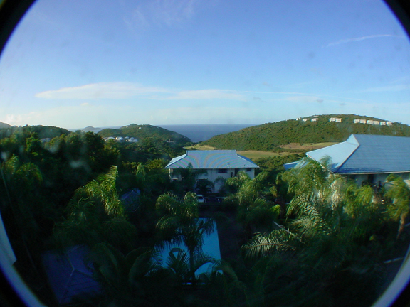 Wide-angle view from our condo.  Atlantic, golf course, pool, and palms.