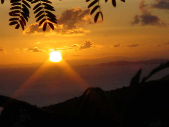 A sunset with Puerto Rico's mountains in the background.